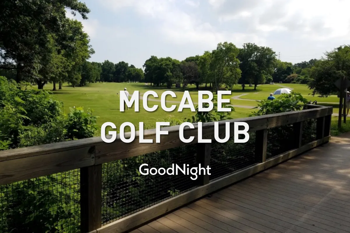 A tranquil golf course scene featuring a wooden deck overlooking lush greenery and fairways. The setting sun creates a peaceful ambiance, ideal for both relaxing after a meeting and hosting group activities outdoors.